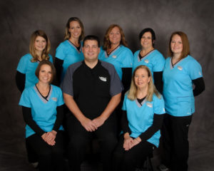 group portrait of Dr. Troutman and dental team
